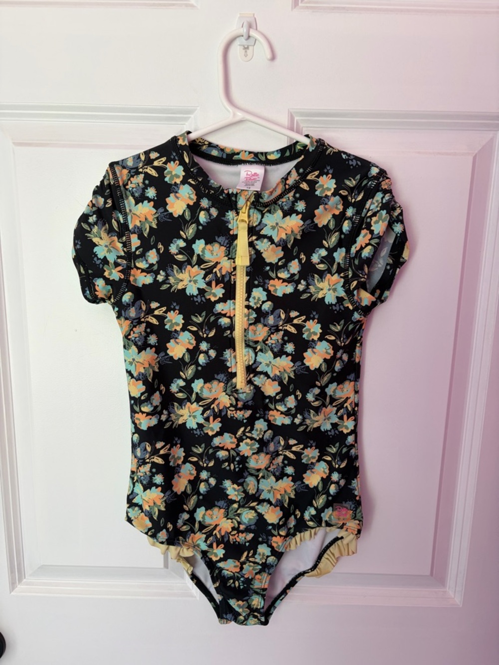 Ruffle Butts Black Floral Rashguard Swimsuit with Yellow Zipper